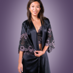 A model wearing a black Bodice Purple Rose Kimono Robe