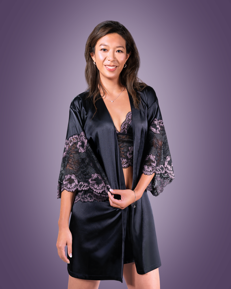 A model wearing a black Bodice Purple Rose Kimono Robe